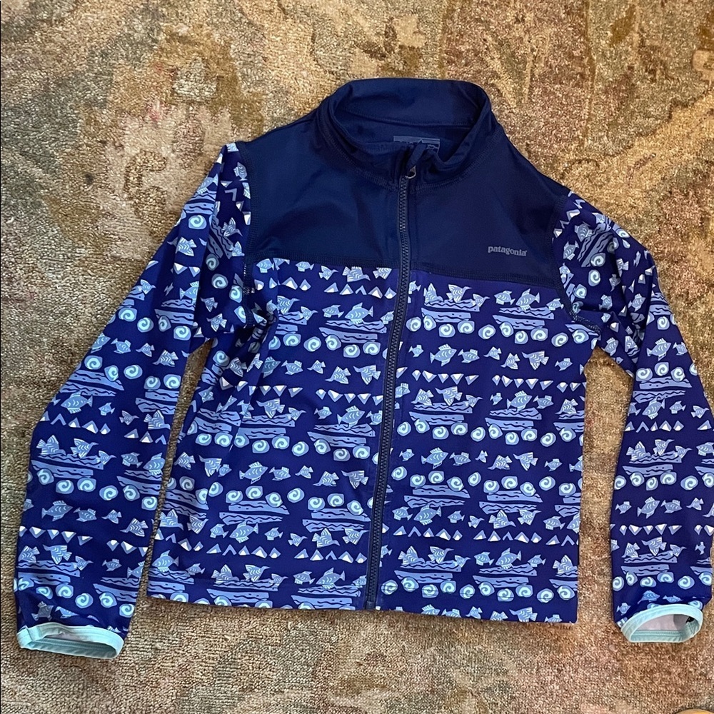 Patagonia Kids light swim jacket.Navy and Light Blue